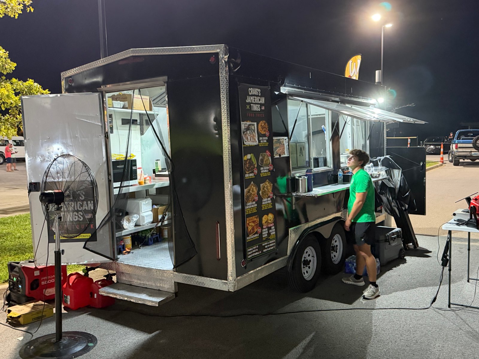 Craig's Jamerican Tings food truck parked and serving at night